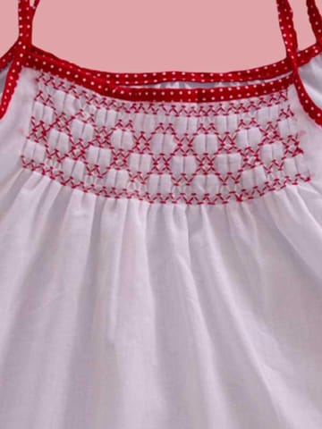 White Frock With Contrast Red Smocking Work